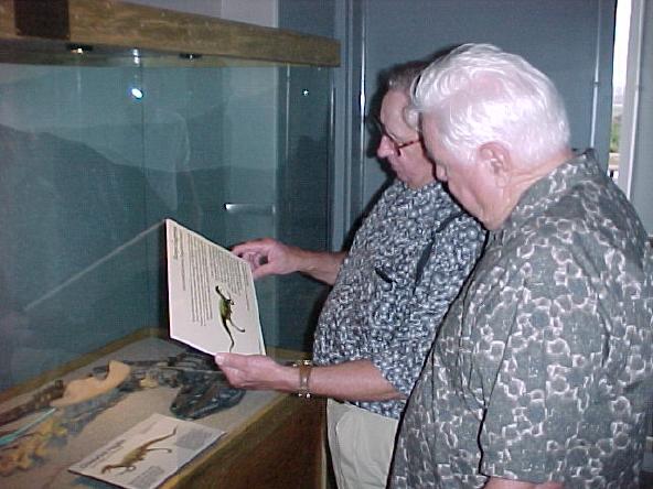 Paul and George Wilson examine the <i>Tanycolagreus</i> plate. (Lewis Church / Courtesy photo)