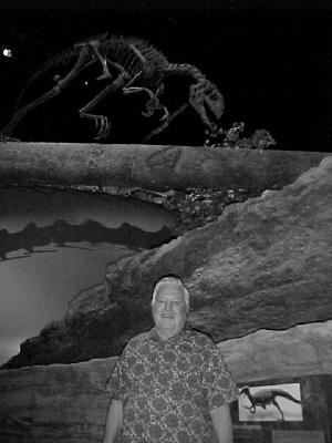 Wilson poses near one of the Tanycolagreus topwilsoni exhibits at the North American Museum of Ancient Life. (Lewis Church / Courtesy photo)