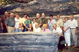 George and family pose in the partially completed <i>Tanycolagreus</i> area of the museum - click to see full-sized image